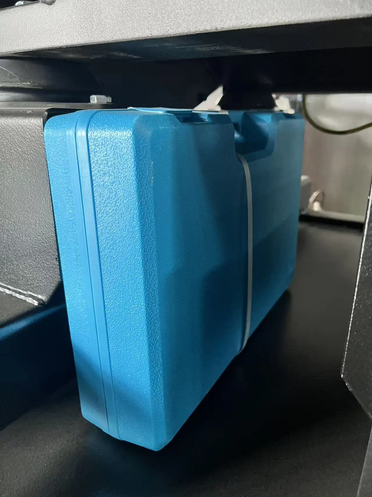 Blue accessory case on the generator base