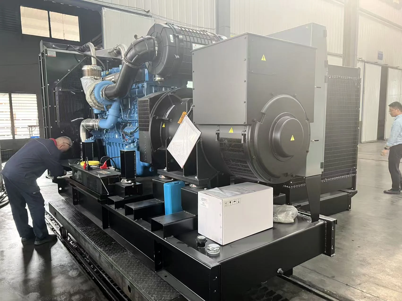 Alternator end of a generator set being inspected in the workshop