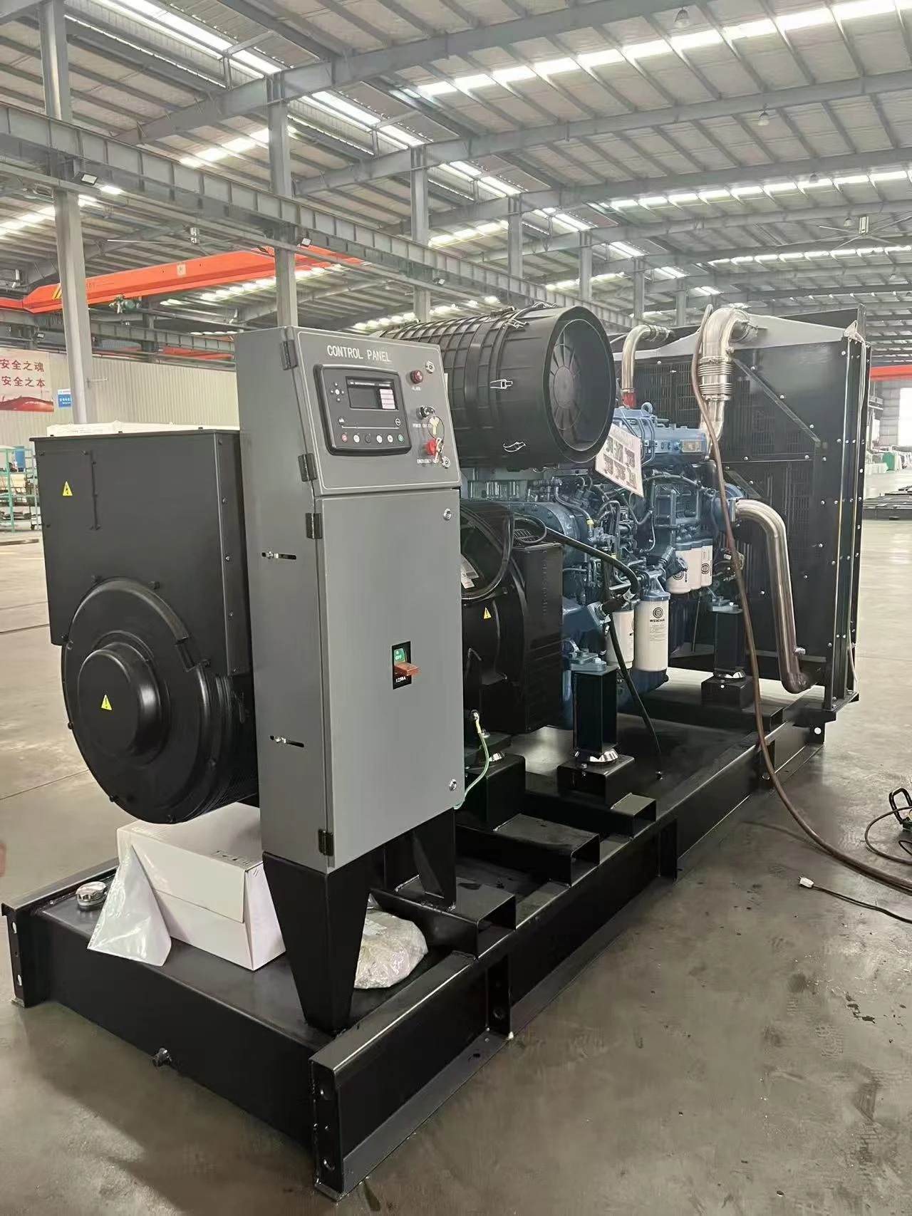Generator control cabinet, engine and radiator during factory preparation